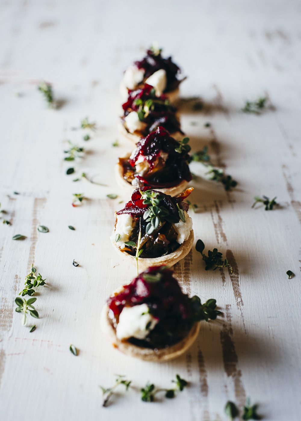 Mini caramelised onion tarts with goats cheese and beetroot relish