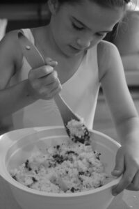 Ava making her Easy Sweet Coconut Slice (back in the day)